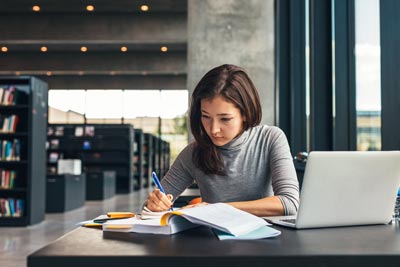 Female student studying at library